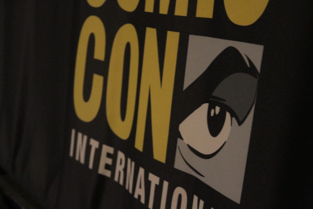 Comic Con International logo on a black table cloth